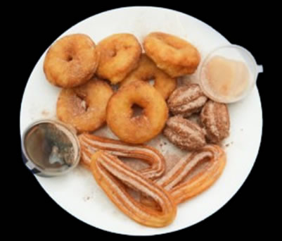 Churros and donuts medley dessert in Dalston London